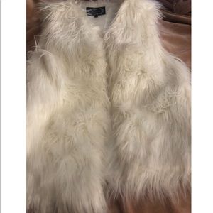 White furry vest